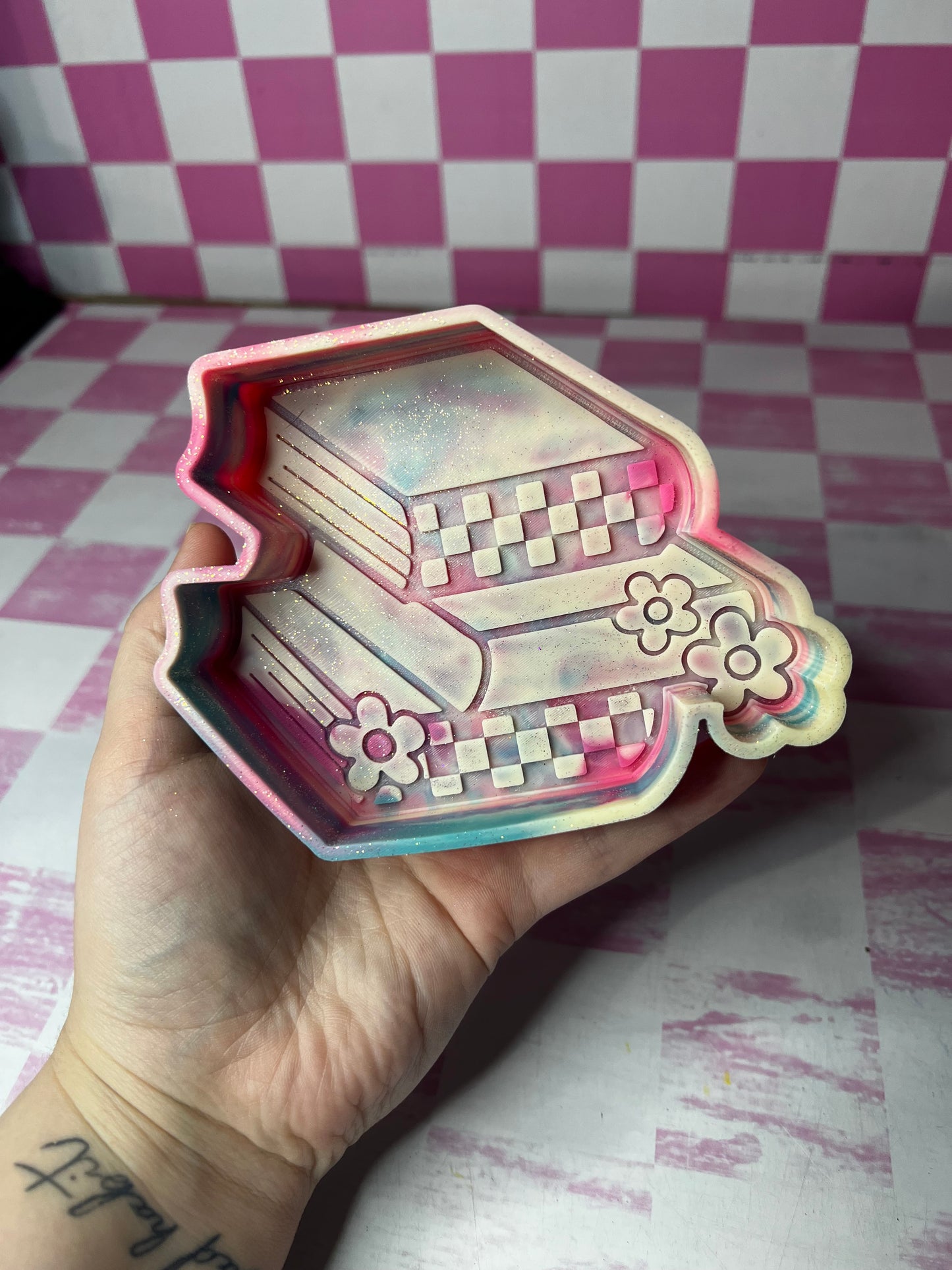checkered bookstack - raising rimes