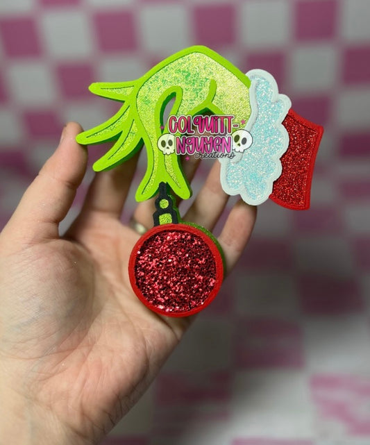 Green Hand Holding Ornament